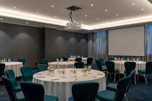Simba banquet meeting room with AV setup for corporate workshops and conferences.
