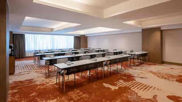 Regency Ballroom: Bright classroom-style corporate training room for professional business meetings.