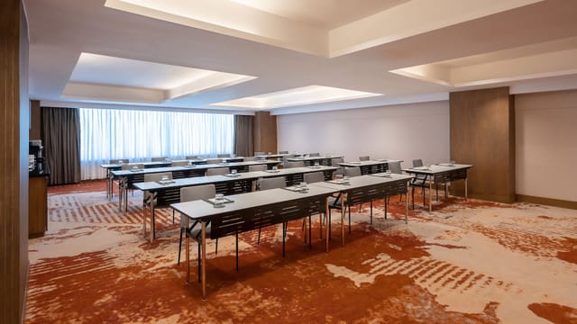 Regency Ballroom: Bright classroom-style corporate training room for professional business meetings.