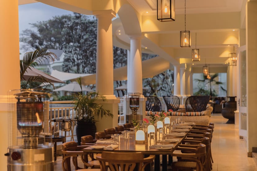Upscale alfresco networking dinner at Hemingways Nairobi with elegant long-table setup.