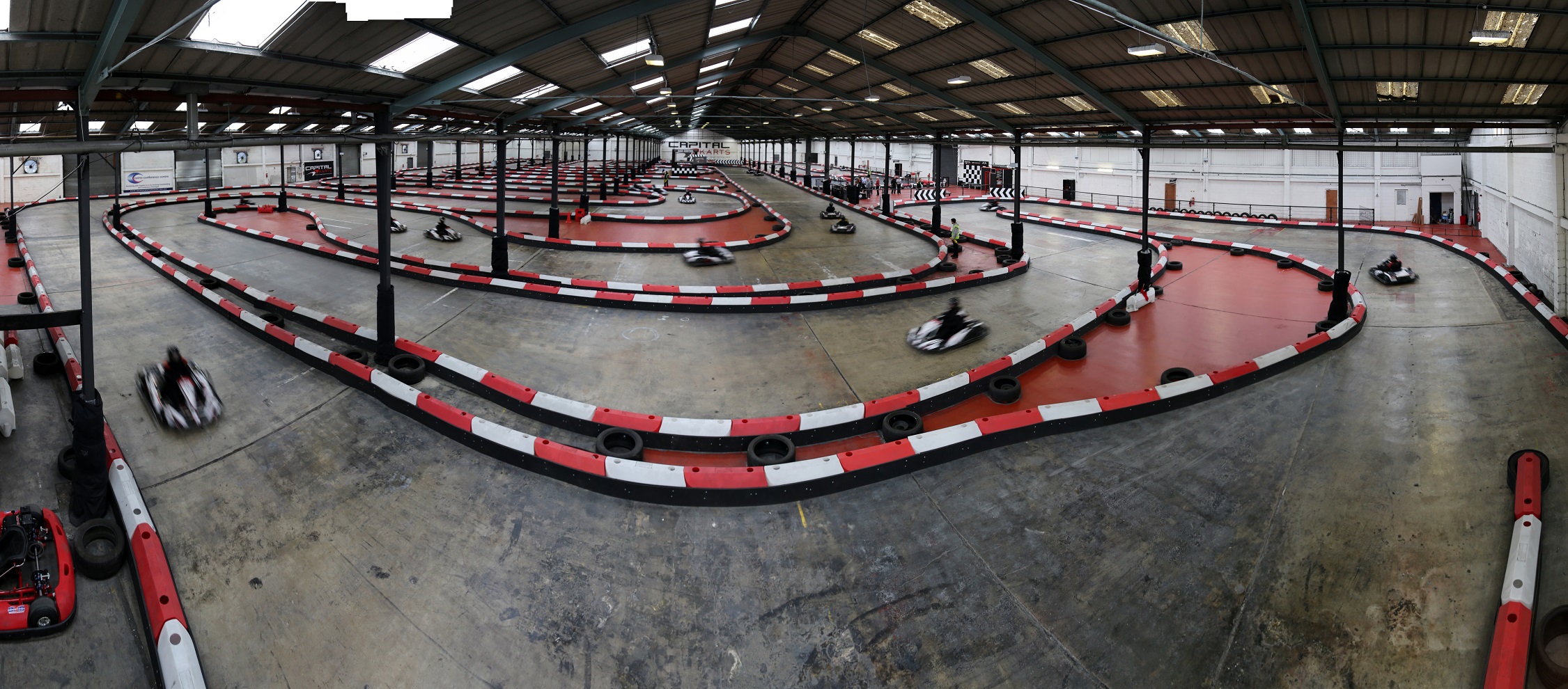 Capital Karts indoor racing track: industrial-chic venue for corporate team building events.