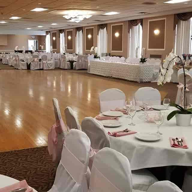 Elegant Main Hall banquet setup with round tables for formal wedding receptions.