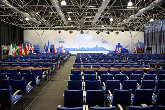 Classroom-style conference setup in Hall #11, ExpoGeorgia with professional dais and stage backdrop.