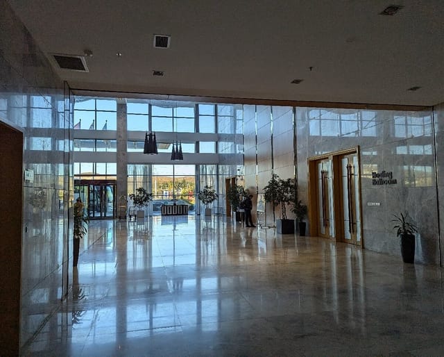 Marble-finished Hualing Ballroom foyer for corporate event registration and conference branding.
