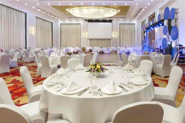 Hualing Ballroom banquet setup with stage for formal gala and corporate event venue in Tbilisi.