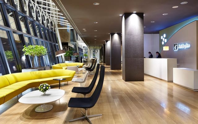 Modern Holiday Inn Tbilisi corporate breakout area with lounge seating for business events.