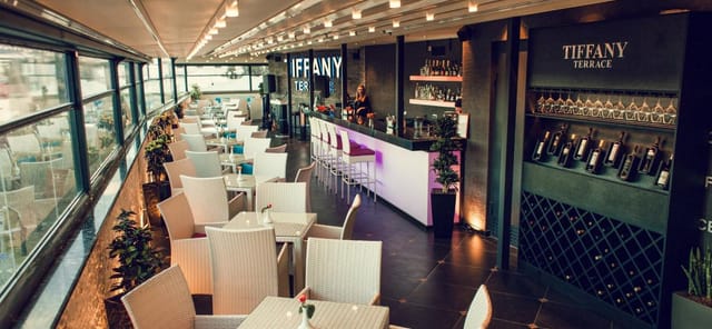 Tiffany Bar rooftop venue for networking and cocktail events, featuring stylish ambient lighting.