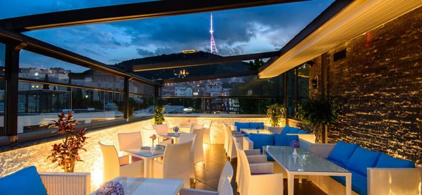 Tiffany Bar rooftop with retractable roof for executive networking and evening receptions.
