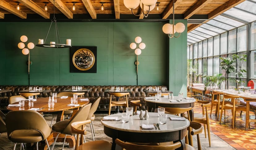 Event Room with emerald walls, perfect for corporate networking and luxury incentive dinners.