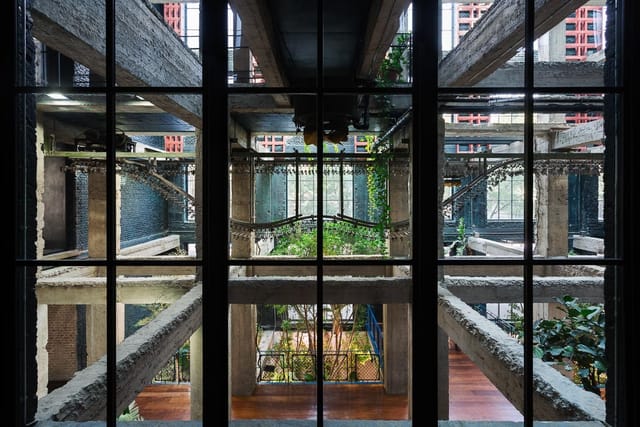 Stamba Hotel industrial amphitheater with concrete architecture for networking or product launch.
