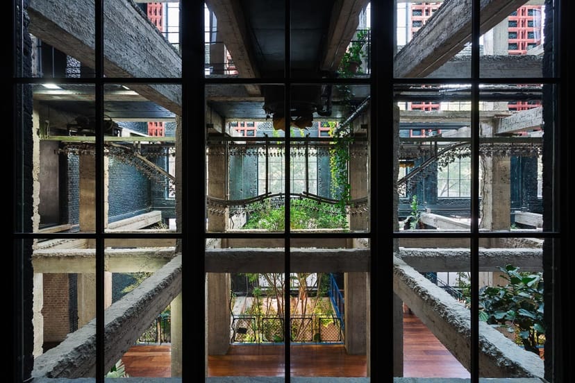 Industrial-chic amphitheater at Stamba Hotel: raw concrete venue for edgy corporate events.