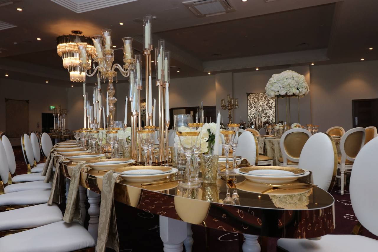 Formal banquet setup at Citrine Suite, Christine House with elegant mirrored tables and candelabras.