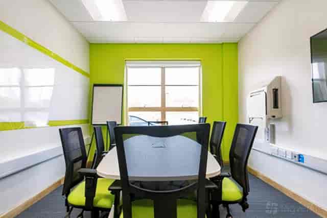 Curie Room meeting space with whiteboard for agile collaborative workshops and corporate events.