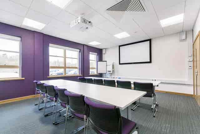Curie Room boardroom with AV for corporate workshops and training sessions.
