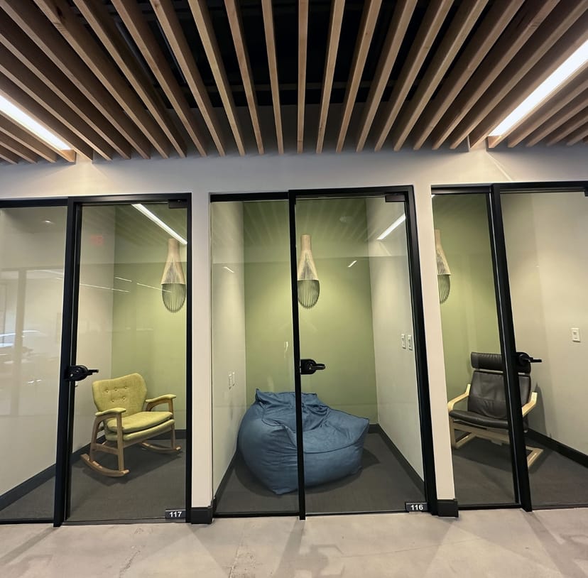 Sound-isolated breakout pods in HEXA Coworking office for private meetings and events.