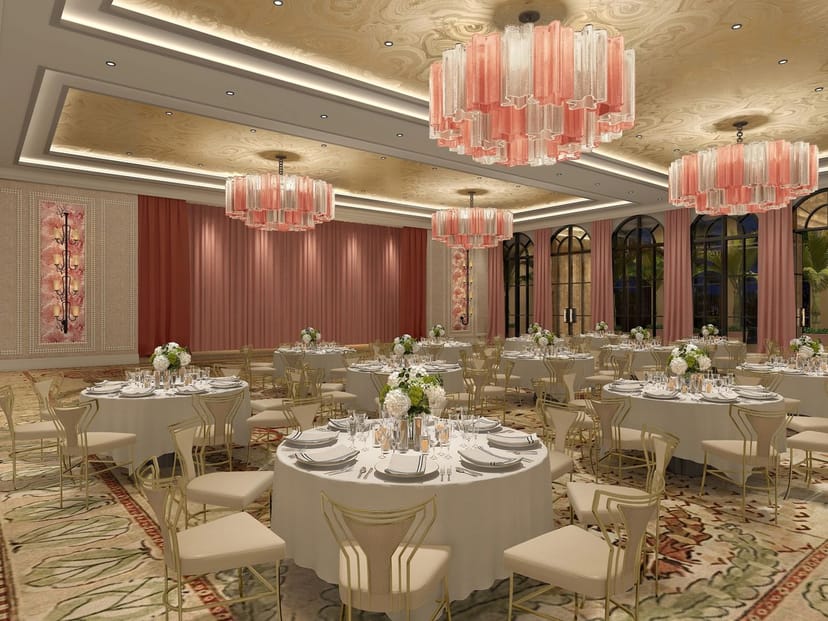 Upscale ballroom with tiered chandeliers for elegant wedding receptions and social galas.