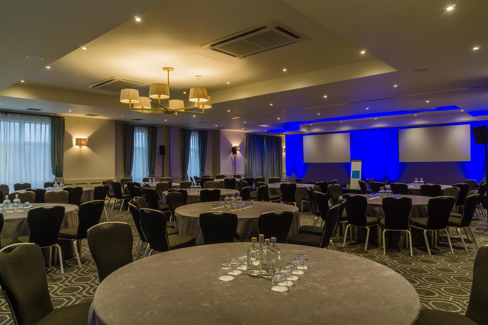Stephenson Suite banquet room with blue lighting for corporate events and social dining.