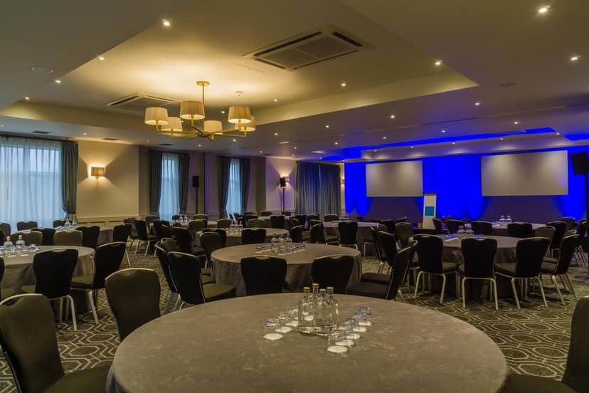 Stephenson Suite banquet room with blue lighting for corporate events and social dining.