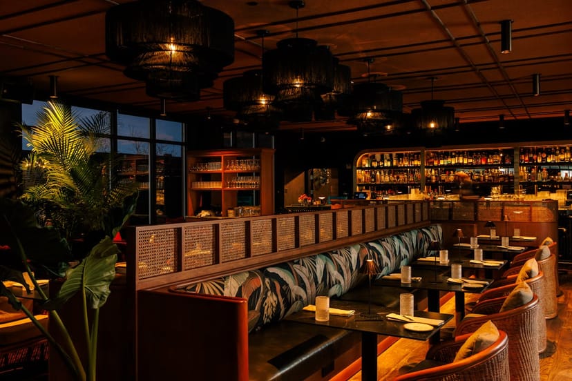 Main indoor lounge at Realm Rooftop Bar with banquette seating for VIP dinners and networking.