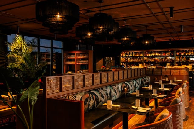 Main Indoor Lounge at Realm Rooftop Bar, plush seating for corporate reception and networking event.