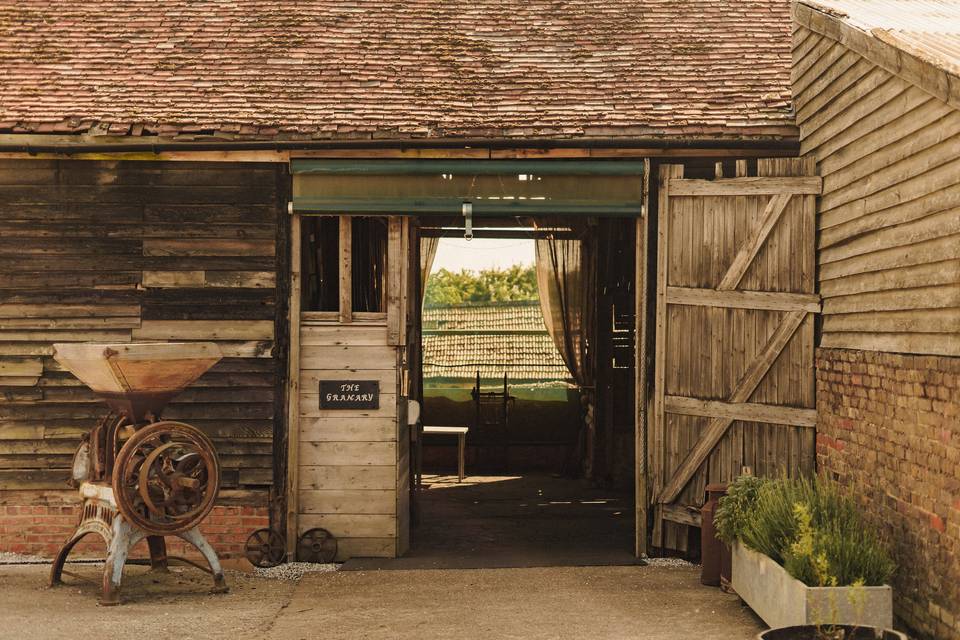 Rustic Granary venue at The Barns at Lodge Farm, ideal for experiential and festival-style events.