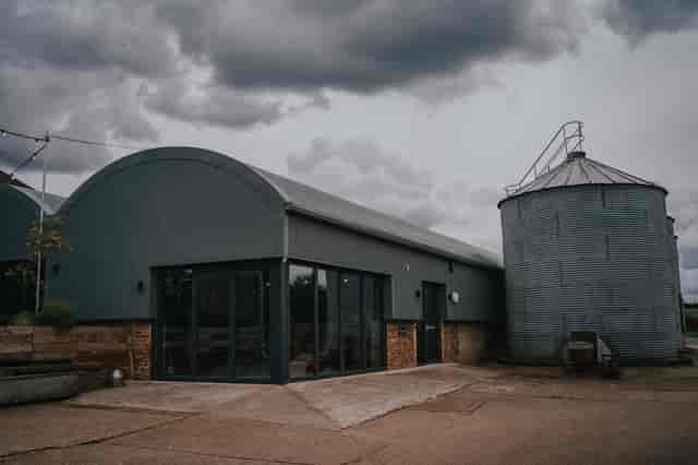 Rustic Boulton & Paul Bar at Lodge Farm: wedding and corporate retreat venue with folding doors.