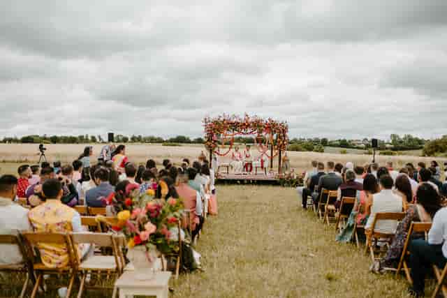 Floral mandap wedding ceremony set-up at The Barns at Lodge Farm outdoor venue.