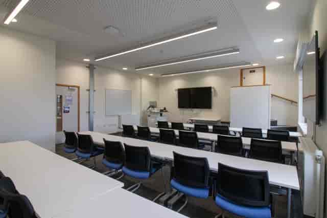 Main Training Room with AV setup for corporate workshops and professional educational sessions.