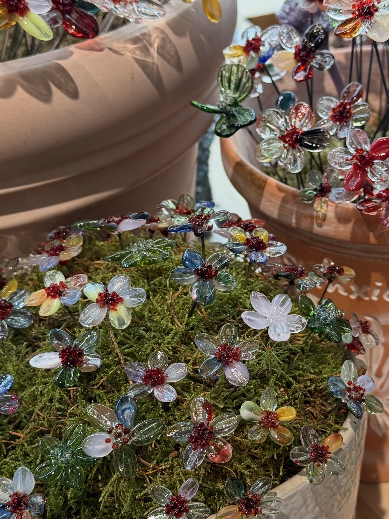 Lampworking glass centerpiece for sustainable event design and whimsical wedding decor.