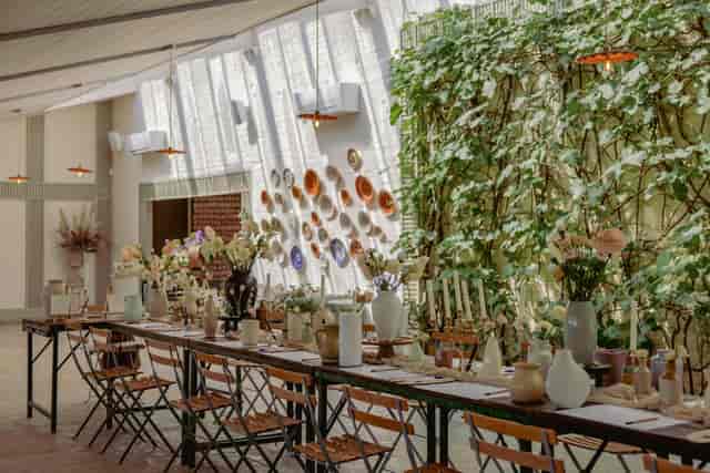 Minimalist garden event space at Kin House with banquet table for intimate weddings and workshops.