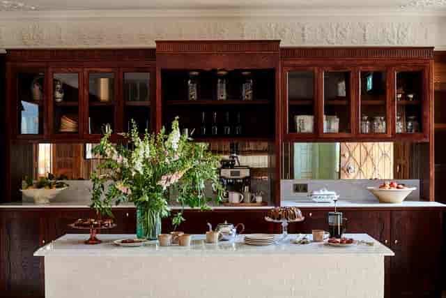 Kin House Hearth Room: Upscale morning breakout session with coffee and pastry catering.