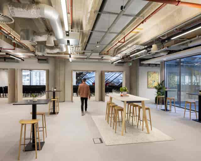Industrial-chic breakout area at 88 Wood Street, perfect for conference networking and meetings.