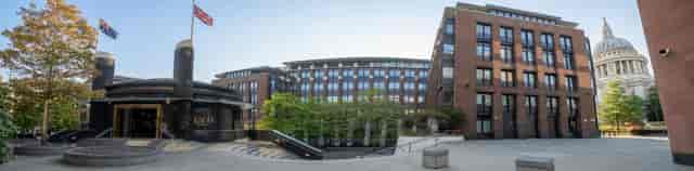 Modern corporate campus plaza with amphitheater seating for outdoor events and networking.