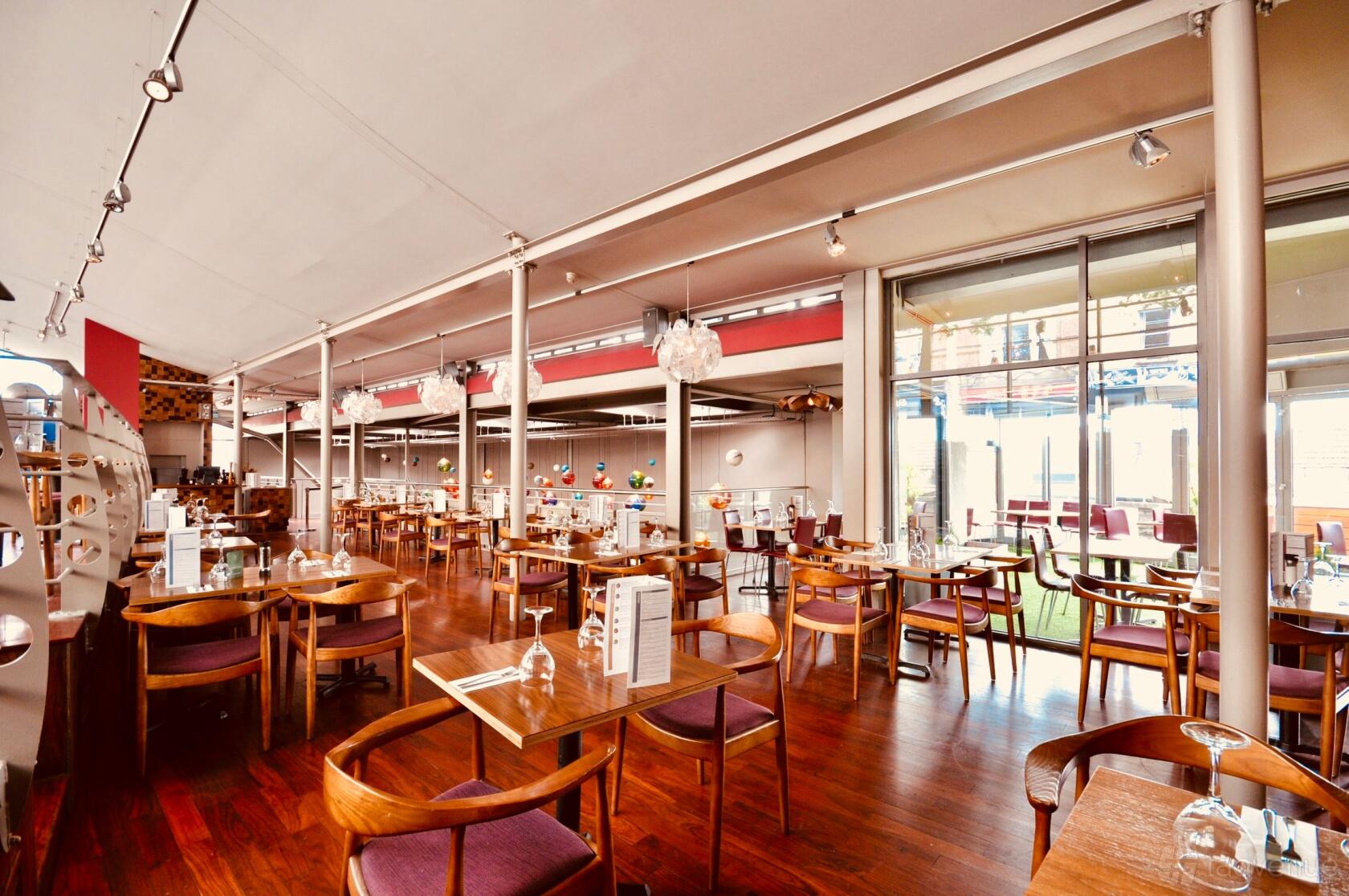 Tank Lounge & Terrace event space with natural light for corporate meetings and networking mixers.