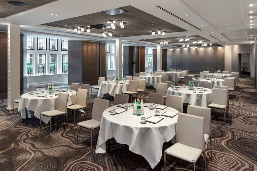 Folio Suite banquet room with elegant decor for corporate workshops and professional luncheons.