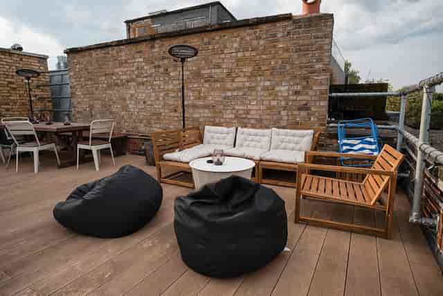 Industrial rooftop terrace with lounge seating for networking and team building events.