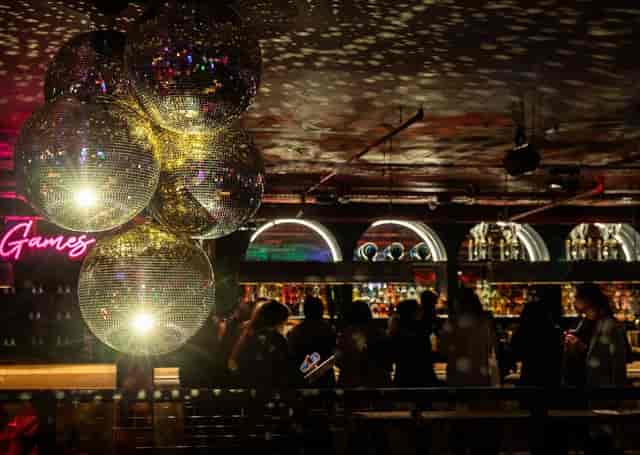 Green Area at Lane7 Camden: Neon-lit experiential venue for corporate events and team building.