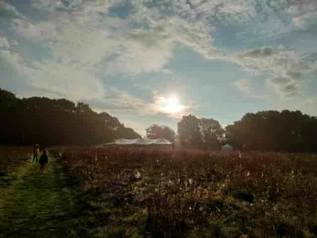 Rustic outdoor event venue in Sussex meadow for marquee weddings and festivals.