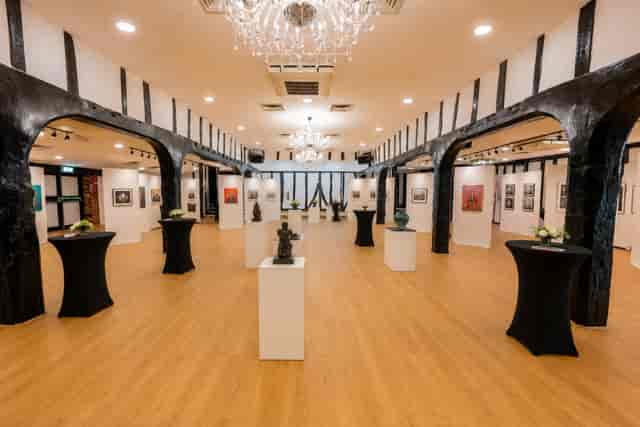 Chichester Suite gallery space with cocktail tables for networking reception and corporate events.