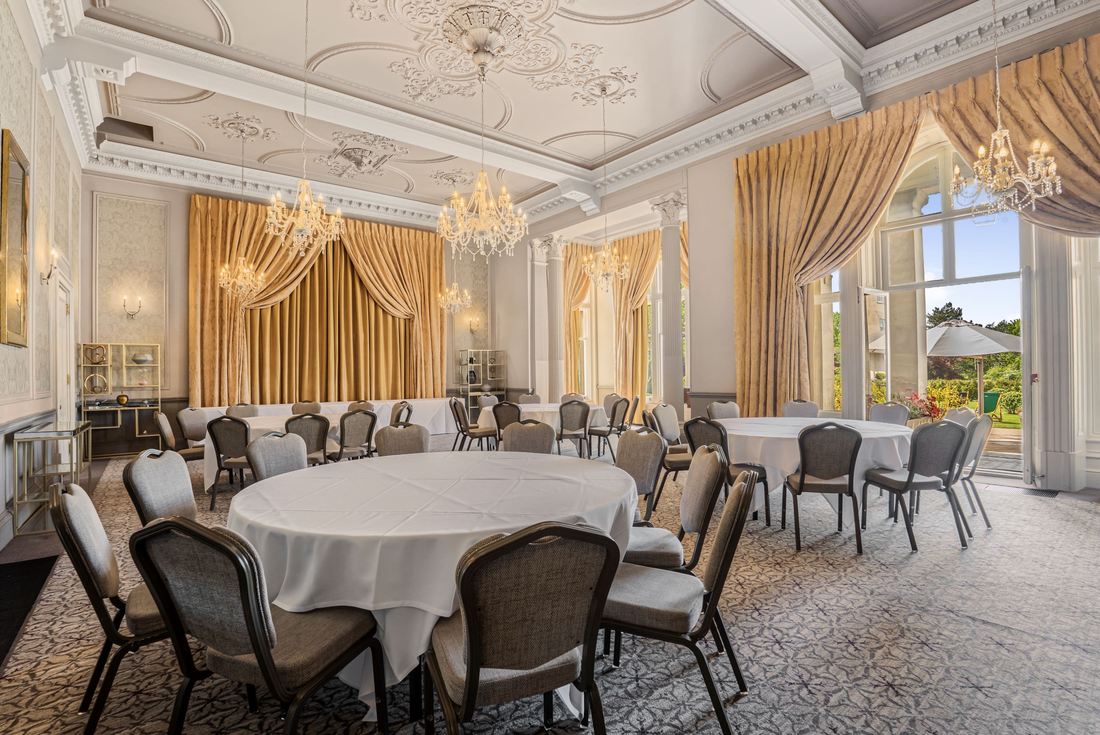 Chichester Suite banquet hall with crystal chandeliers for luxury weddings and corporate events. - Banner