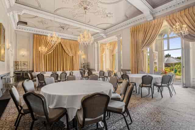 Chichester Suite banquet hall with crystal chandeliers for luxury weddings and corporate events.
