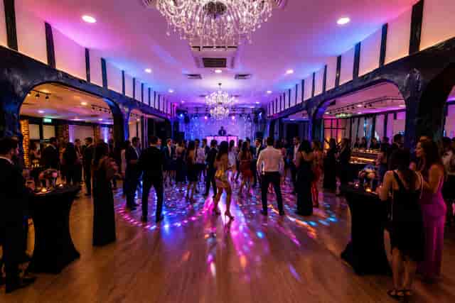 Chichester Suite wedding or corporate gala reception with dynamic dance floor lighting.