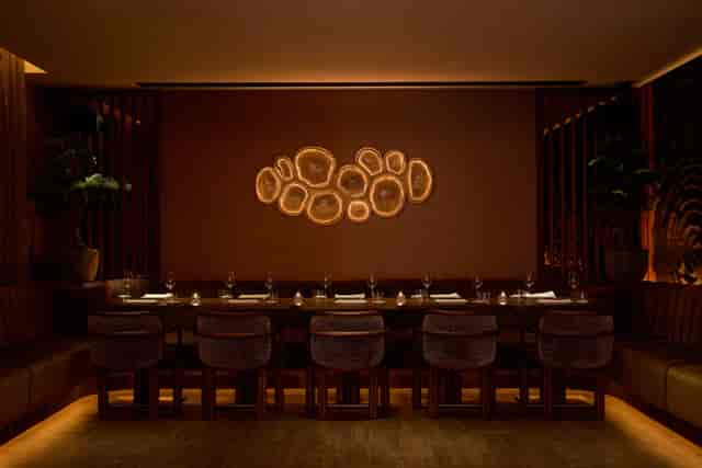 Private dining room in MA/NA with ambient lighting for high-end corporate events and dinners.