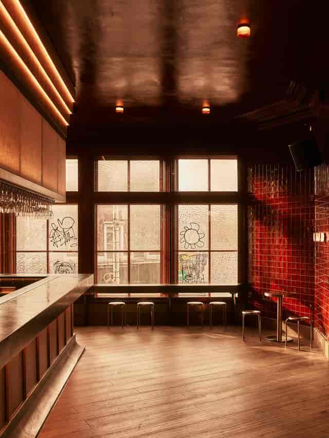 Palais Ballroom venue for evening receptions, featuring a sleek bar setup for networking events.