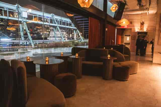 Main bar at The Hatch Club with floor-to-ceiling city views for corporate receptions and VIP events.