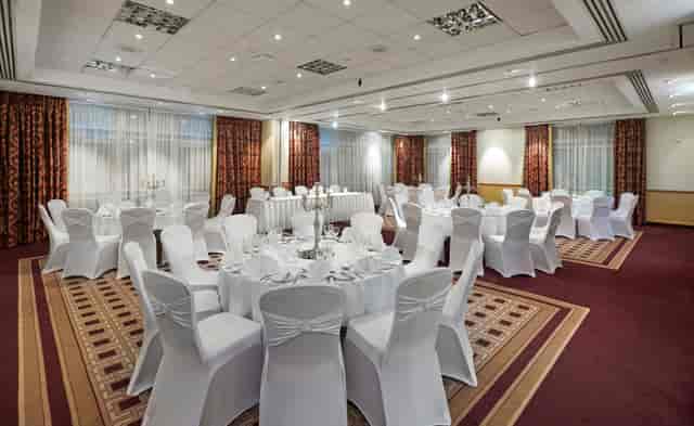 Main Hall banquet room with round tables, perfect for corporate dinner or wedding venue rental.