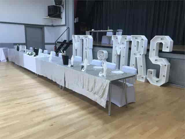 Main Hall wedding venue at Crofton Halls with marquee letters and banquet tables for event hire.