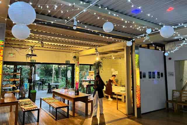 Industrial event space at Leyton Green with fairy lights, ideal for networking and workshops.