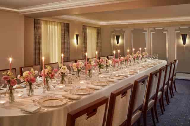 Buckingham Room long table set for luxury corporate dinner and upscale event.