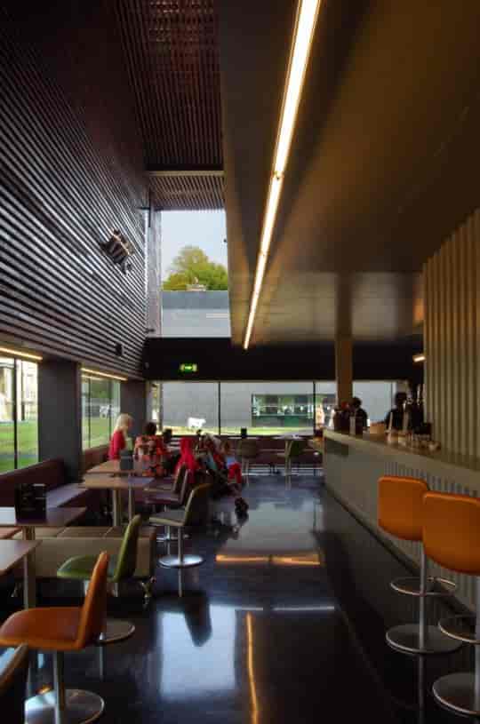 Modern breakout space at Bernie Grant Arts Centre with natural light for networking events.